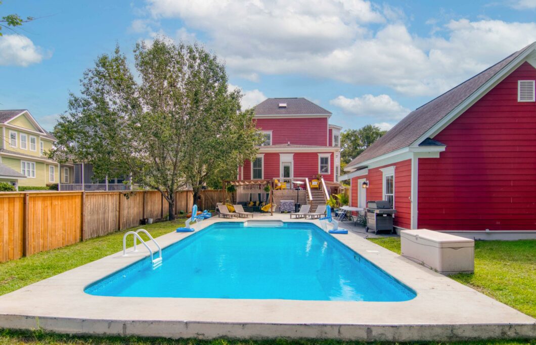 red house with pool sold by oyster point