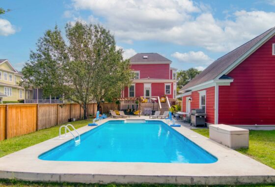 red house with pool sold by oyster point